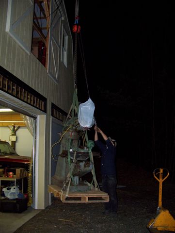 Hoisting the Bridgeport off the truck at the Cowboy Gunworks workshop.
