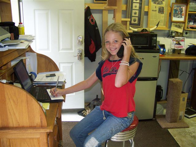 'Little Ruby' answering the phones at Cowboy Gunworks.