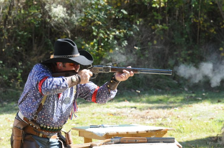 Red River Ray shooting his Cowboy Gunworks 20 inch pistol grip 1873 and a pair of 5.5 inch Ruger New Vaqueros. Both his rifle and pistols have FULL RACE Action Jobs.' width=