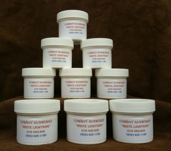 Image of stacked jars of White Lightning Gun Grease.