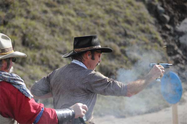 Cardboard Cowboy ejecting magazine with brass in the air ...